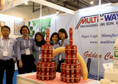 Team moment in front of our two‑tower display