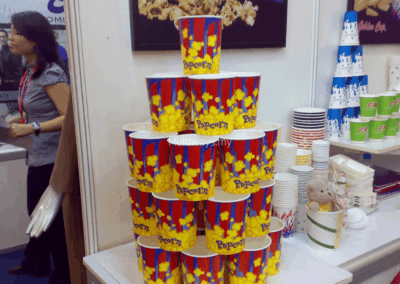 Popcorn buckets arranged in a tiered display to demonstrate print quality and structural integrity
