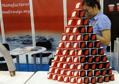 A sculptural arch of stacked paper cups, creating a unique focal point for our table display